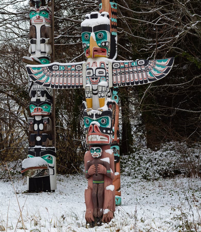 Colorful Totem Wood Pole in the Forest Background. Totem Pole Stock ...