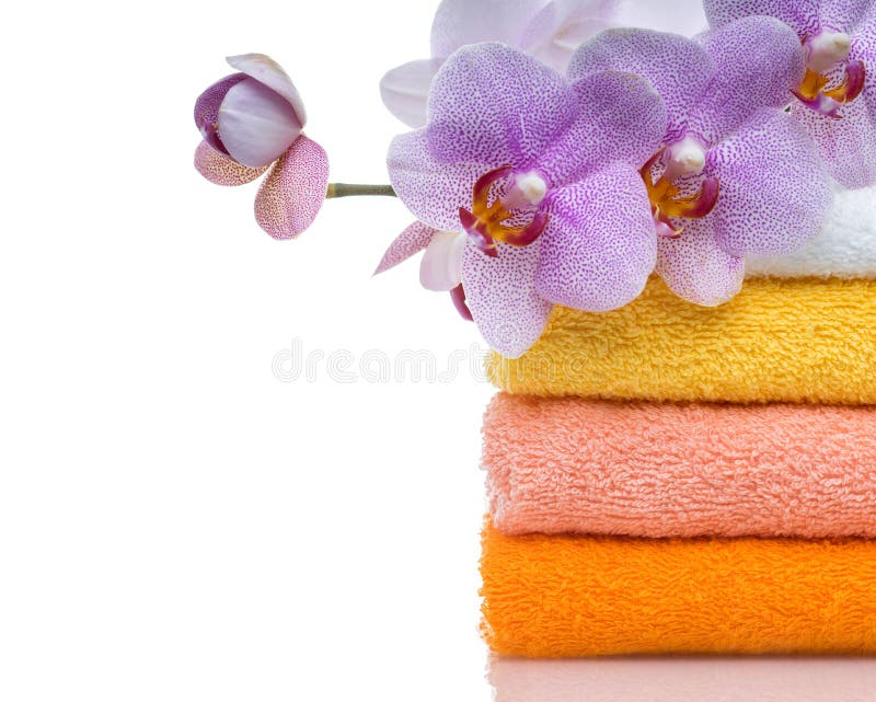 Colorful towels and flower isolated