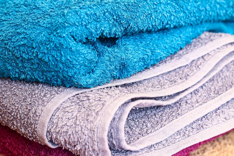 Colorful Towels on Wooden Floor Stock Photo - Image of fluffy, home ...