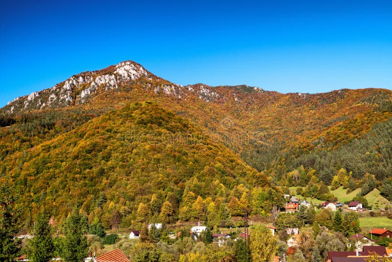 Colorful trees in autumn forest. Hill Sip over village Rojkov - Stankovany, Slovakia