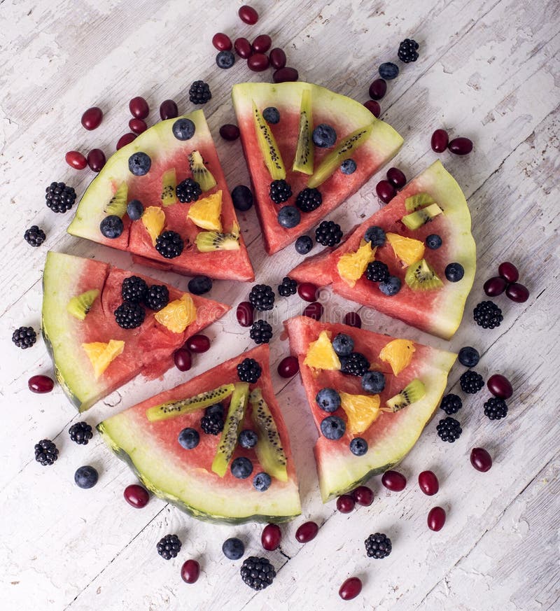 Colorful tropical fruit watermelon pizza