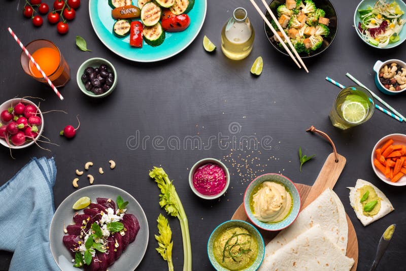Colorful vegetarian feast dinner table from above