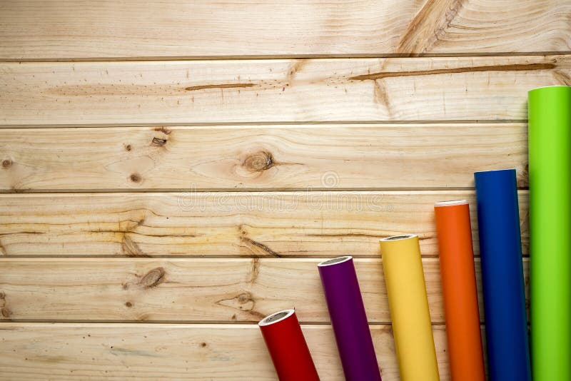 Colorful vinyl rolls on wooden background royalty free stock photography Colorful vinyl rolls on wooden background royalty free stock photography