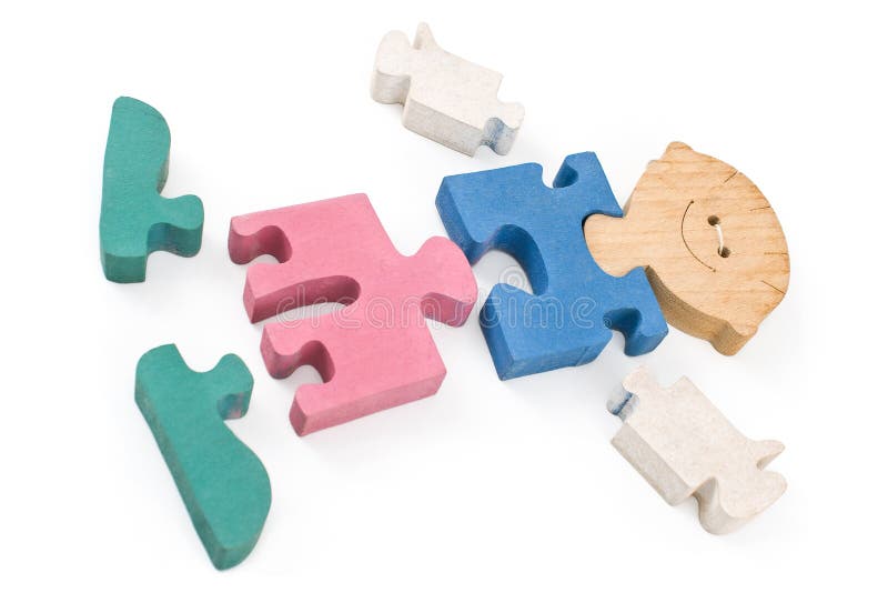 Colorful wooden boy puzzle pieces royalty free stock photography