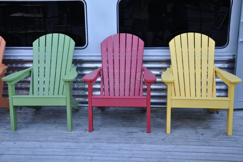 Colorful wooden chairs stock photo