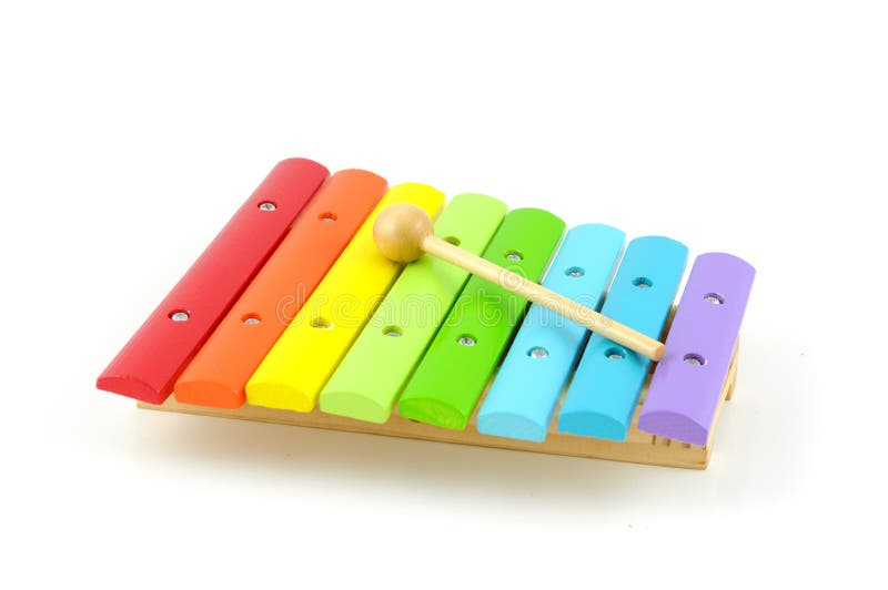 Colorful wooden xylophone with stick stock photography
