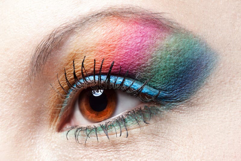 Colorfull rainbow make-up on woman eye stock image