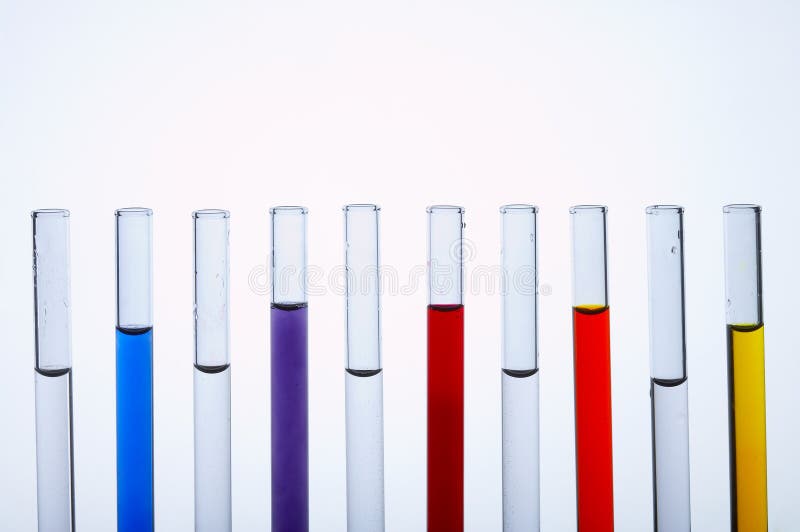 Glass test tubes standing in a line filled with colorful liquids. Glass test tubes standing in a line filled with colorful liquids