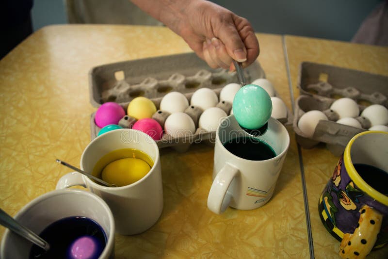 Coloring Easter Eggs with Dye is a Fun Holiday Tradition Stock Photo