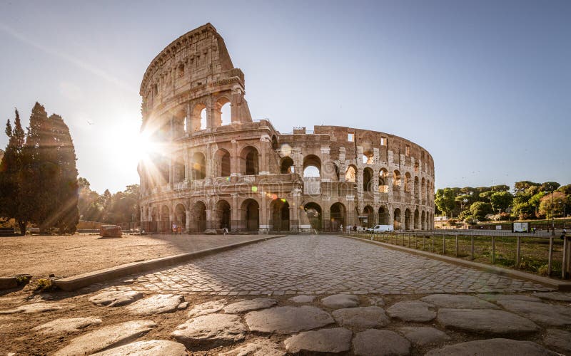 Colosseum at sunrise, Rome, Italy, Europe. Rome ancient arena of gladiator fights. Rome Colosseum is the best known landmark of Rome and Italy. Colosseum at sunrise, Rome, Italy, Europe. Rome ancient arena of gladiator fights. Rome Colosseum is the best known landmark of Rome and Italy