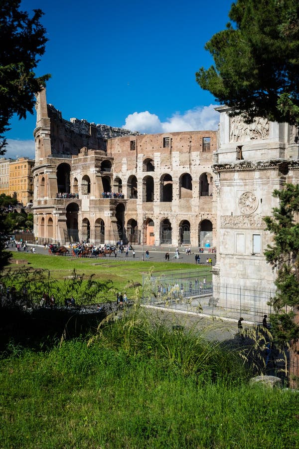Colosseum and Constantine Arch, Rome. Rome architecture and landmark. Rome Colosseum is one of the best known monuments of Rome and Italy. Colosseum and Constantine Arch, Rome. Rome architecture and landmark. Rome Colosseum is one of the best known monuments of Rome and Italy