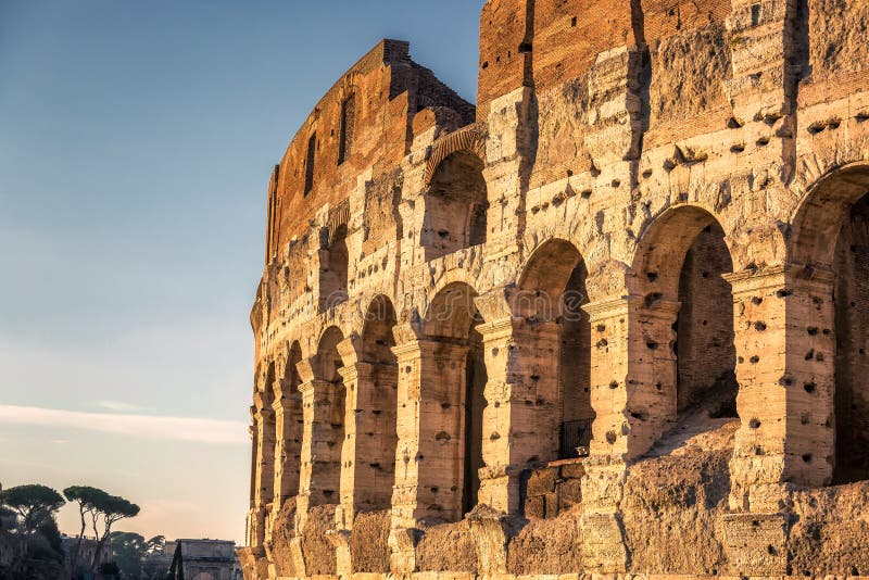 Colosseum at sunset, Rome. Rome best known architecture and landmark. Rome Colosseum is one of the main attractions of Rome and Italy. Colosseum at sunset, Rome. Rome best known architecture and landmark. Rome Colosseum is one of the main attractions of Rome and Italy