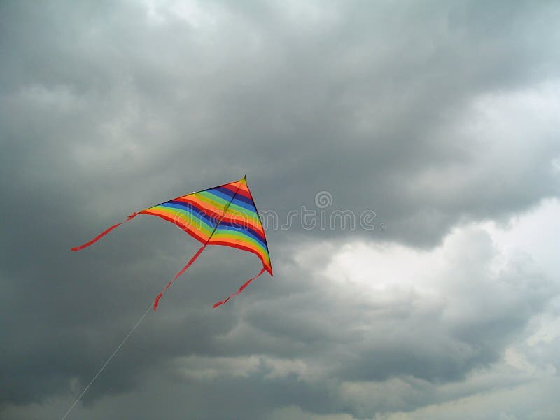 Colour Bright Flying Kite Against the Storm Sky Stock Photo Image of