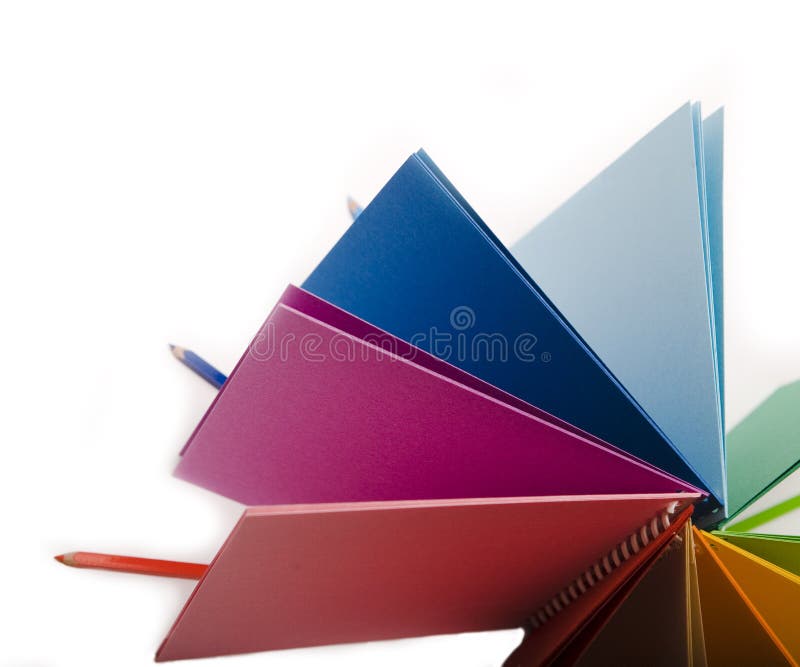 Creioane colorate și blocnotes colorat stock photos
