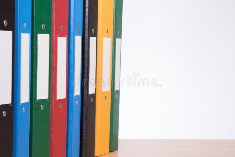 Coloured office document folders on shelf closeup royalty free stock image Coloured office document folders on shelf closeup royalty free stock image