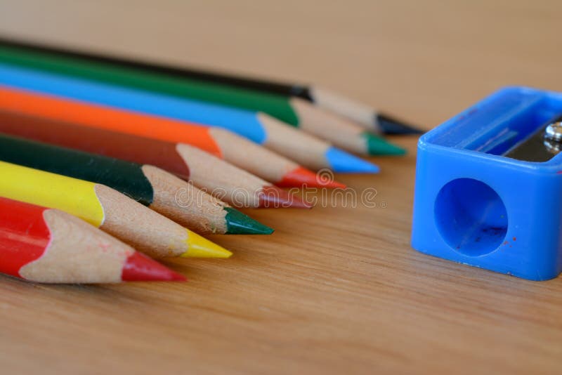 Coloured Pencils and Sharpener on Wooden Table. Stock Image Image of