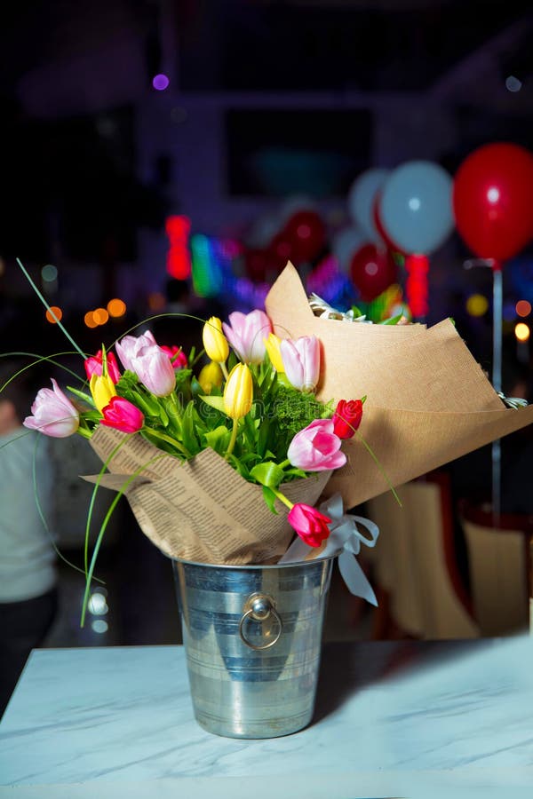Coloured tulips in vase indoors. Fresh Colorfull tulip flowers bouquet. Beautiful colorful fresh spring flower tulips royalty free stock photo