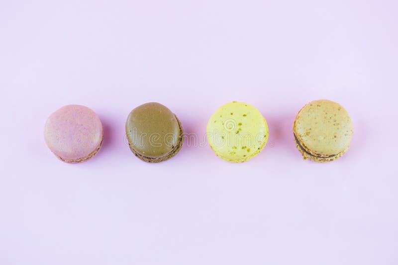 Colourful french macaroons or macaron on pink background stock image Colourful french macaroons or macaron on pink background stock image