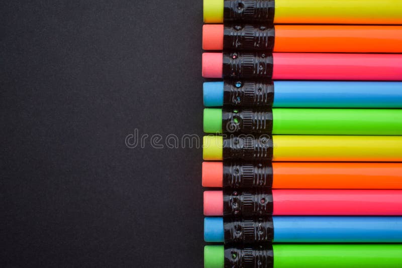 Colourful Pencils with Rubber Eraser on the Black Background. Group of
