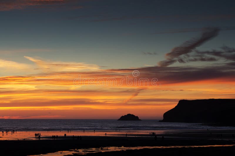 Colourful sunset over the beach at Polzeath