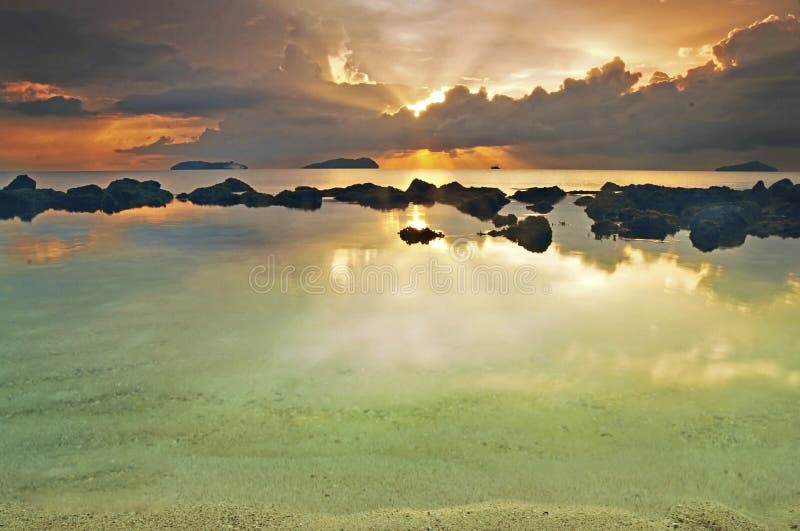 Colourful sunset with ray of lights at horizon seen at Kota Kinabalu, Sabah, Malaysia.