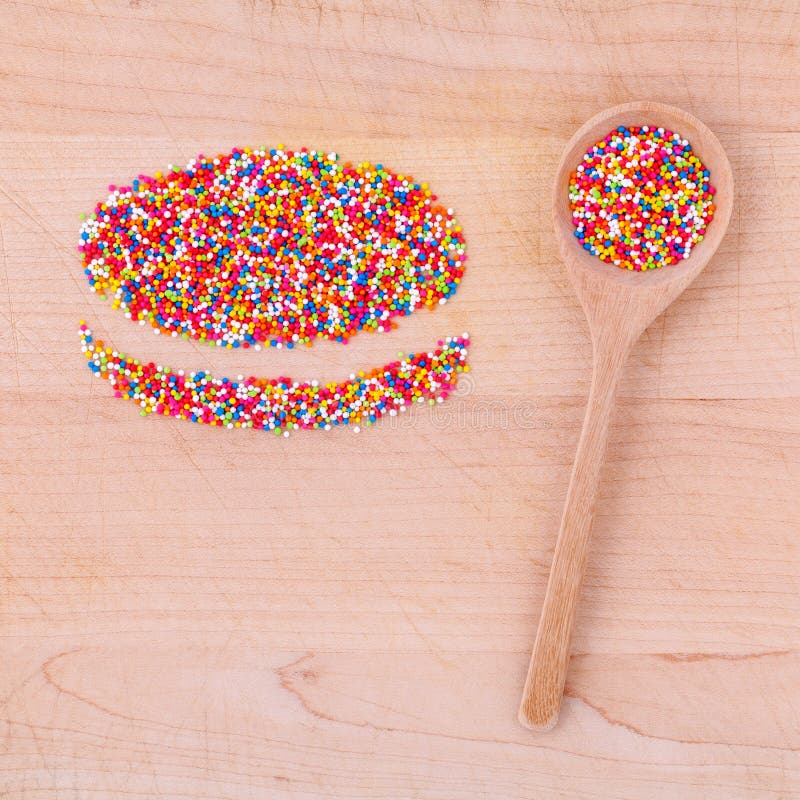 Colourful Topping Baking in Wooden Spoon and the Shape of Macaroons on