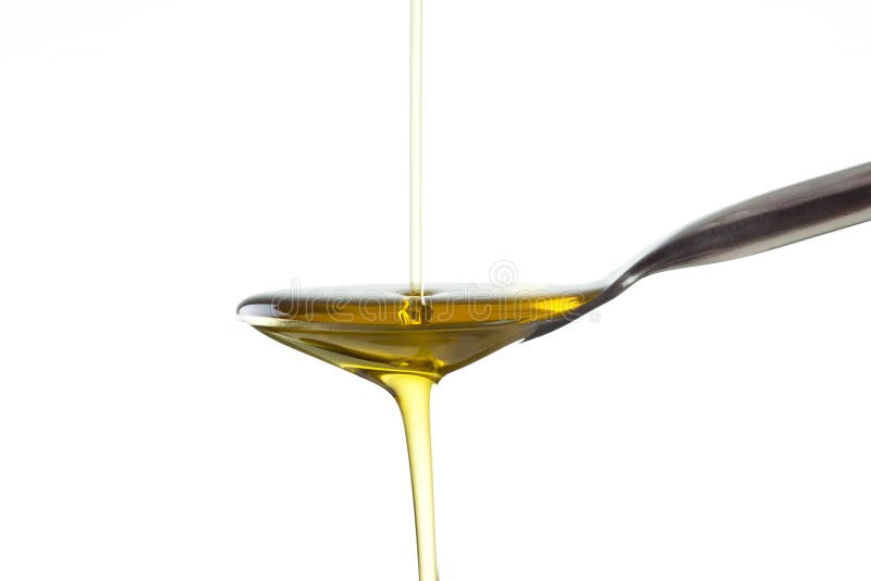 Macro shot of Olive oil poured to/from a spoon on pure white background. Macro shot of Olive oil poured to/from a spoon on pure white background.