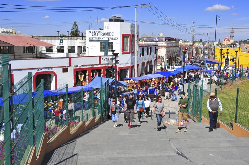 PUEBLA, MEXICO. CIRCA DECEMBER 2012. Characterized by its vibrantly colored buildings and narrow streets, Puebla is a popular spot for tourists, despite being built under multiple active volcanoes. PUEBLA, MEXICO. CIRCA DECEMBER 2012. Characterized by its vibrantly colored buildings and narrow streets, Puebla is a popular spot for tourists, despite being built under multiple active volcanoes.