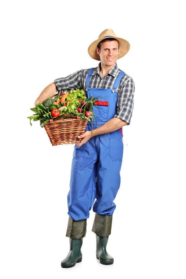 Full length portrait of a farmer holding a basket full of vegetables isolated on white background. Full length portrait of a farmer holding a basket full of vegetables isolated on white background