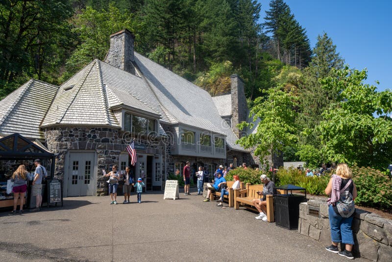 Columbia Gorge, Oregon - July 8, 2019: Crowds of people gather around the visitors center of Multnomah Falls, a famous waterfall