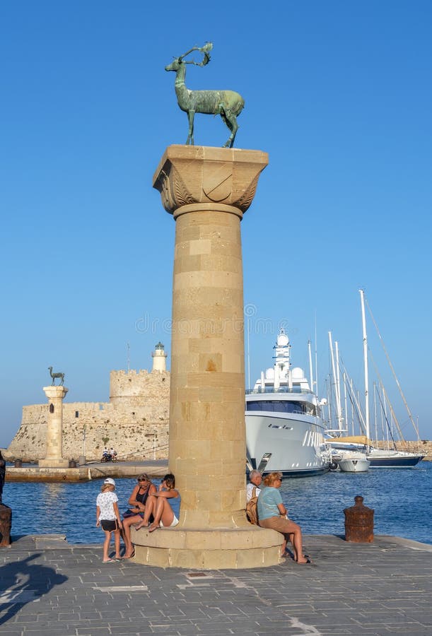 Columns with Deer Statues in Mandraki Harbor of Rhodes Town, Greece Editorial Stock Image