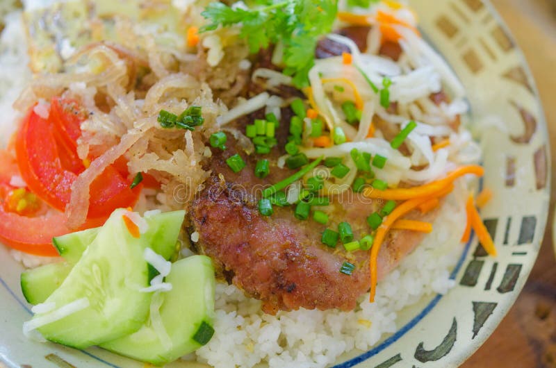 Com tam - Vietnamese broken rice with grilled pork chop. Popular street food in Vietnam