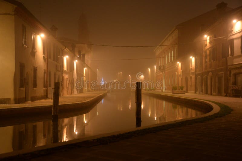 Comacchio, Italy. Night view of a canal. winter fog royalty free stock images Comacchio, Italy. Night view of a canal. winter fog royalty free stock images