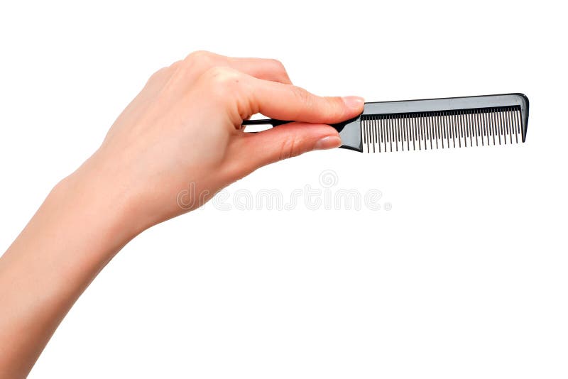 Comb in the hand stock images