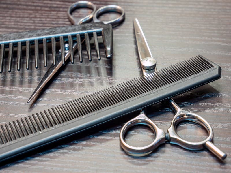 Comb and scissors hair salon stock images