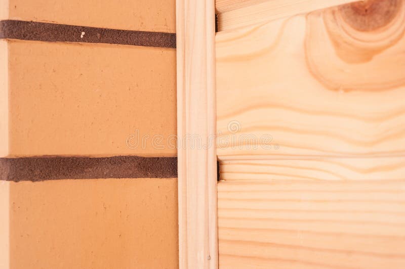 The Combination of Beige Decorative Brick with Pine Clapboard in the Interior Stock Photo