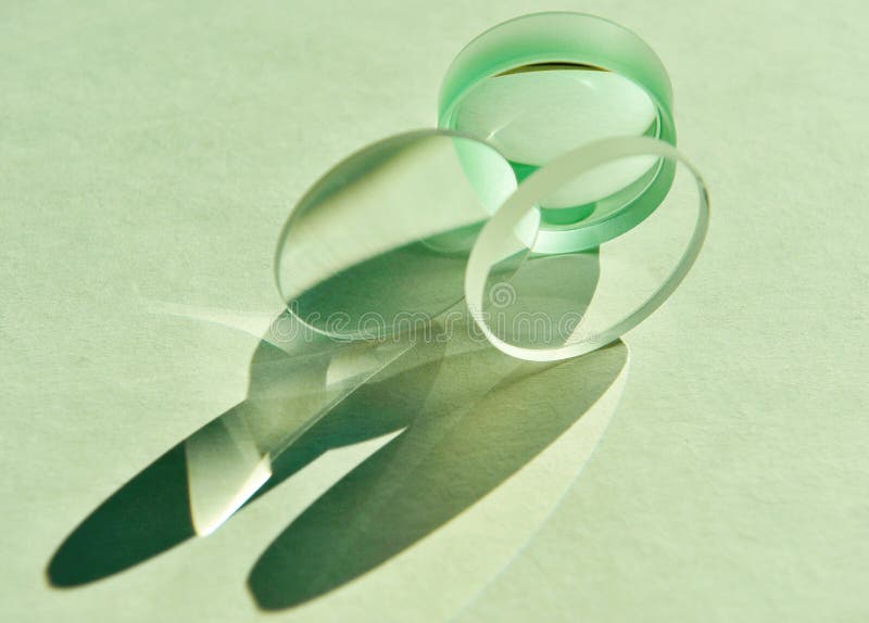 Combination of convex and concave lens refracts and reflects natural light.