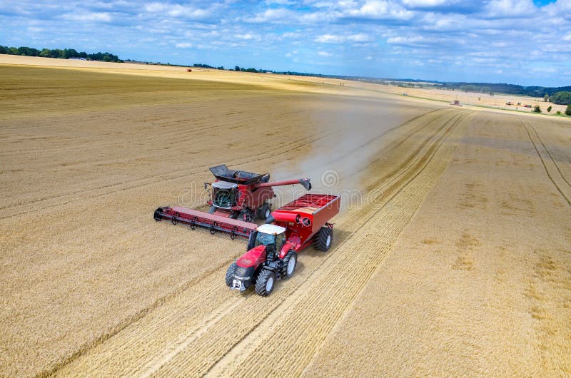 Combines and Tractors Working on the Wheat Field Stock Photo Image of