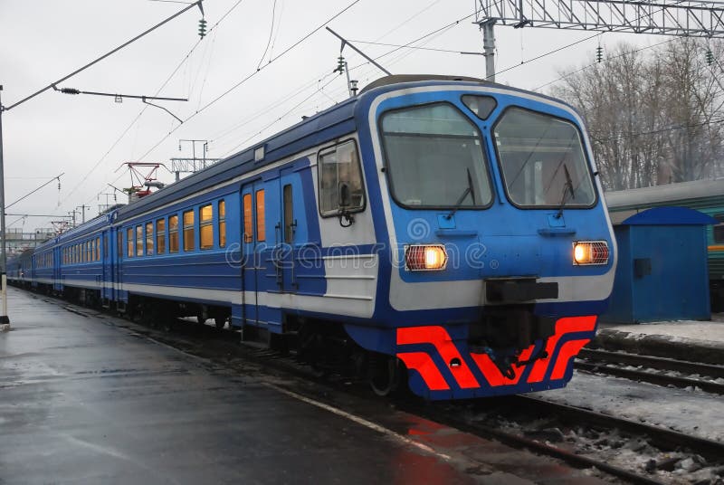 Electric passenger train in the station in winter. Electric passenger train in the station in winter