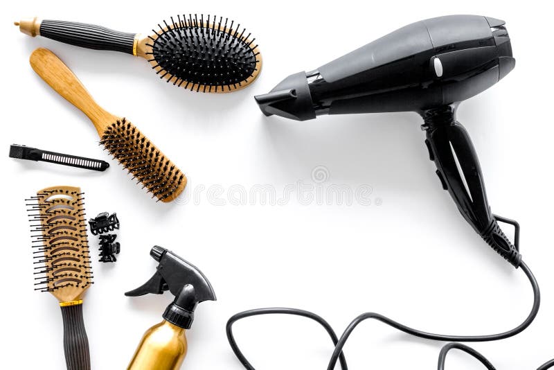 Combs and hairdresser tools in beauty salon on white background top view copyspace