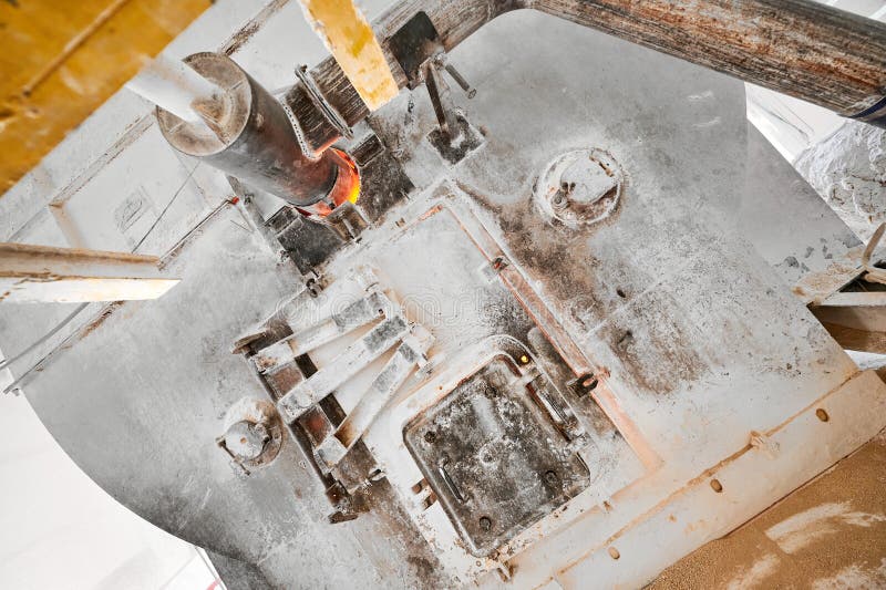 Combustion chamber of tubular rotary kiln at calx factory. Details of manufacturing equipment at large limestone industrial complex upper view