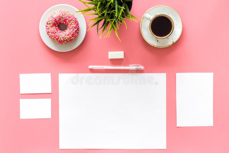Come up with brand identity. Blank stationery for branding near coffee and donut on pink background top view mockup royalty free stock photo Come up with brand identity. Blank stationery for branding near coffee and donut on pink background top view mockup royalty free stock photo