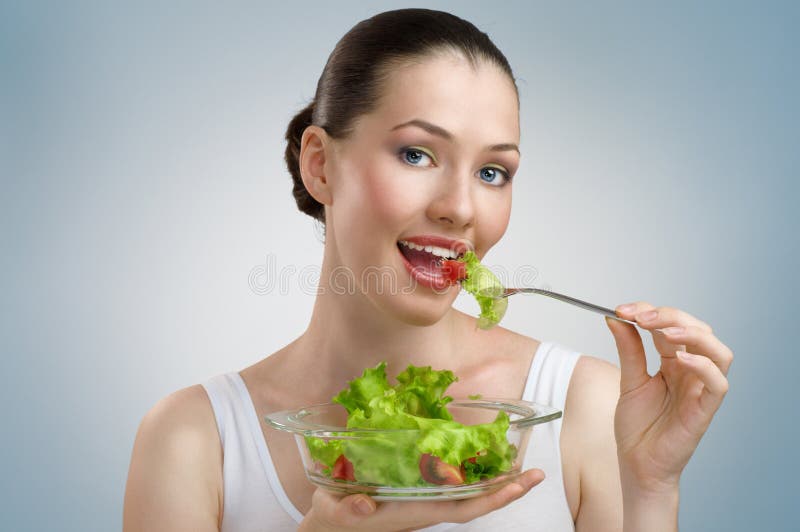 Comer alimentos saudáveis imagens de stock royalty free