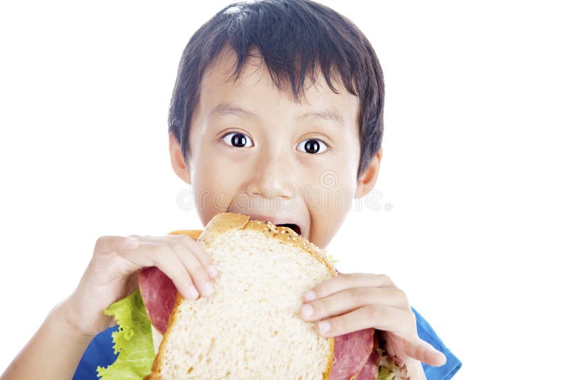 Comendo o sanduíche grande imagem de stock Comendo o sanduíche grande imagem de stock