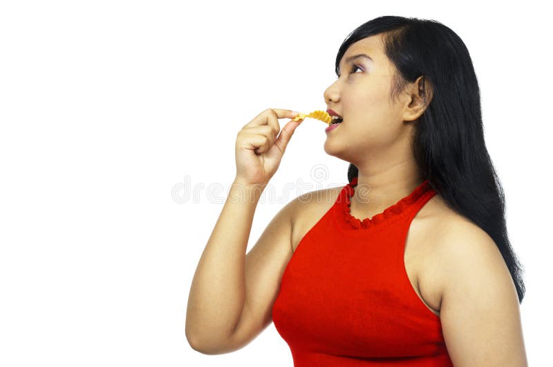 Comer Chubby gordo da menina imagens de stock royalty free Comer Chubby gordo da menina imagens de stock royalty free