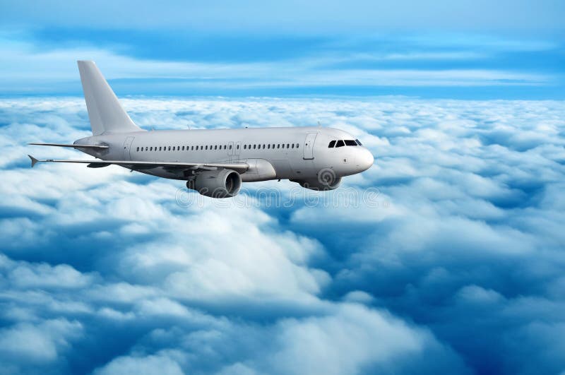 Commercial passenger airplane flying over clouds stock photos Commercial passenger airplane flying over clouds stock photos