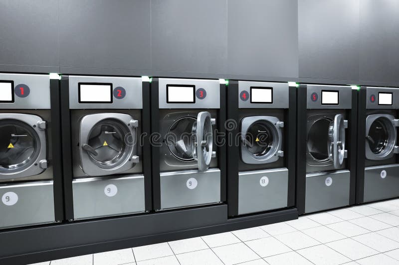 Commercial self-service washing machines stand in a row royalty free stock image