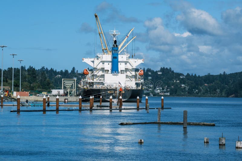 Commercial Ship at Coos Bay Awaits Load of Fresh Timber Stock Photo