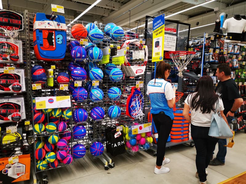 Commercial worker at Decathlon and customers ask for information royalty free stock photography Commercial worker at Decathlon and customers ask for information royalty free stock photography