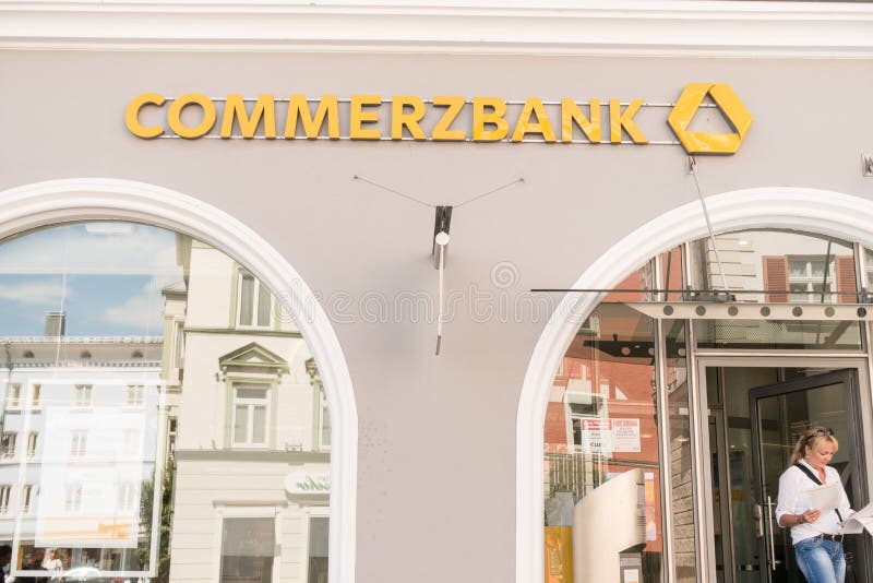 Commerzbank bank with a customer walking out